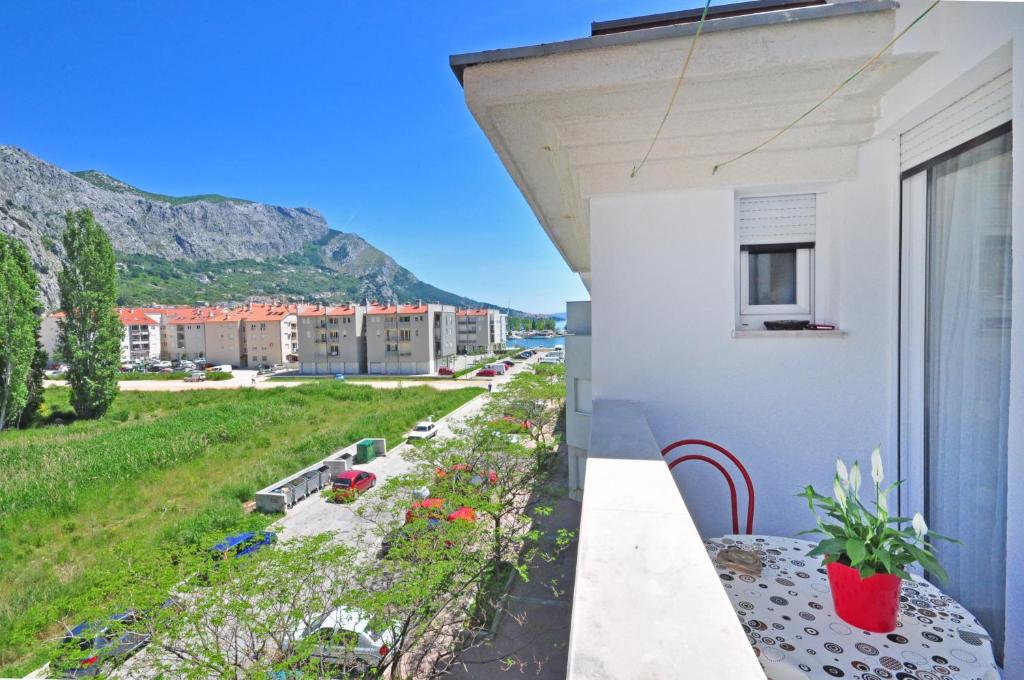 a balcony with a view of a building at Apartment Luna in Omiš