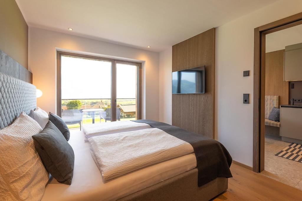 Postel nebo postele na pokoji v ubytování Fankhauser Apartments