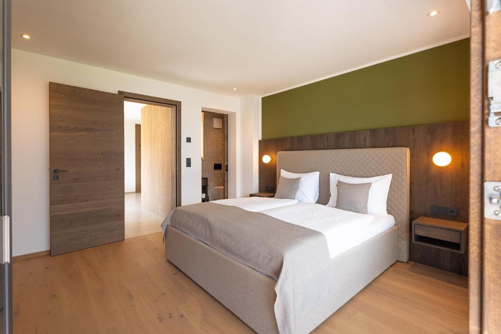Postel nebo postele na pokoji v ubytování Fankhauser Apartments