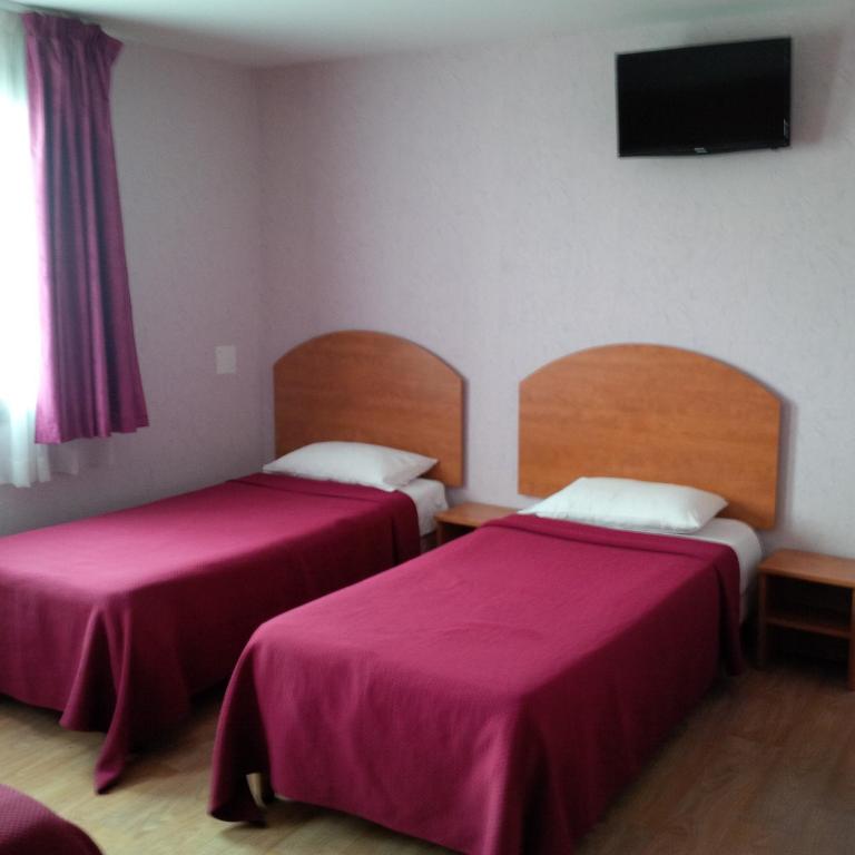 Postel nebo postele na pokoji v ubytování Prim Hotel Reims