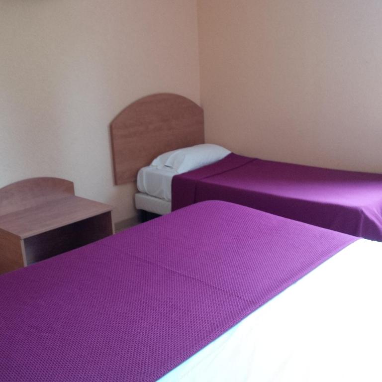 Postel nebo postele na pokoji v ubytování Prim Hotel Reims
