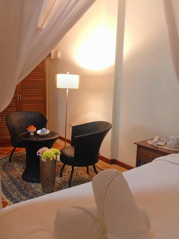 Postel nebo postele na pokoji v ubytování Siam Tara Resort Chiangkhong