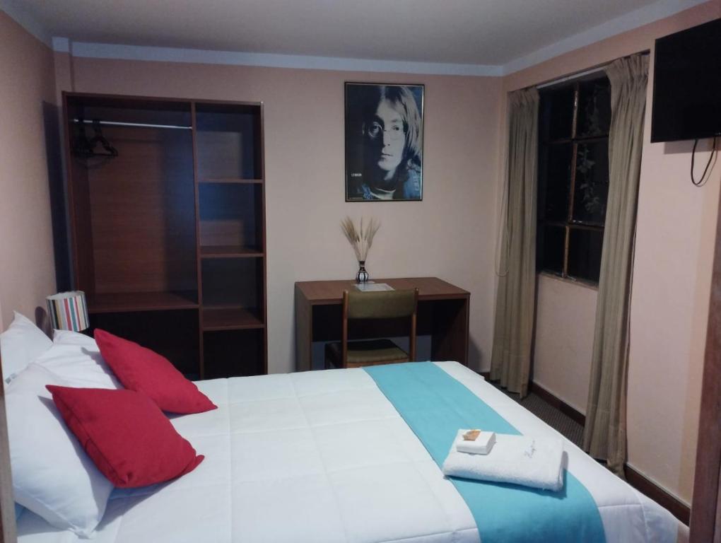 Postel nebo postele na pokoji v ubytování Huaytusive Inn Hotel