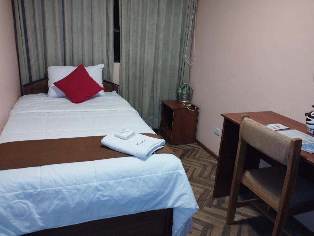 Postel nebo postele na pokoji v ubytování Huaytusive Inn Hotel