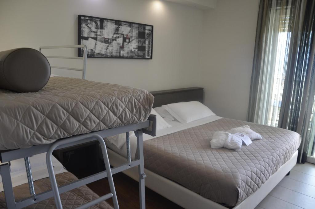 Postel nebo postele na pokoji v ubytování Yes Hotel Touring & SPA