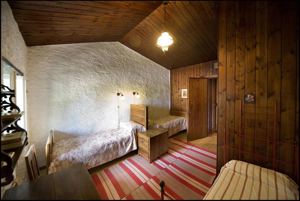 Postel nebo postele na pokoji v ubytování Agriturismo Famiglia al Castello Di Bagnolo