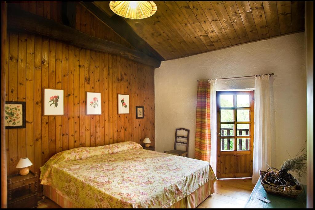 Postel nebo postele na pokoji v ubytování Agriturismo Famiglia al Castello Di Bagnolo