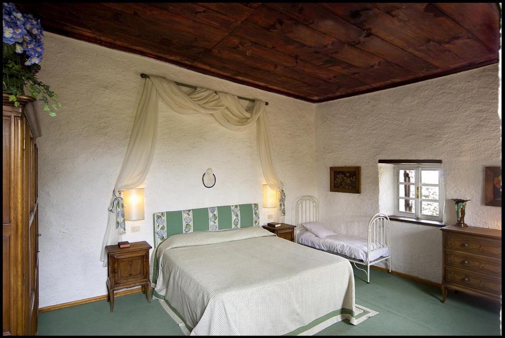 Postel nebo postele na pokoji v ubytování Agriturismo Famiglia al Castello Di Bagnolo