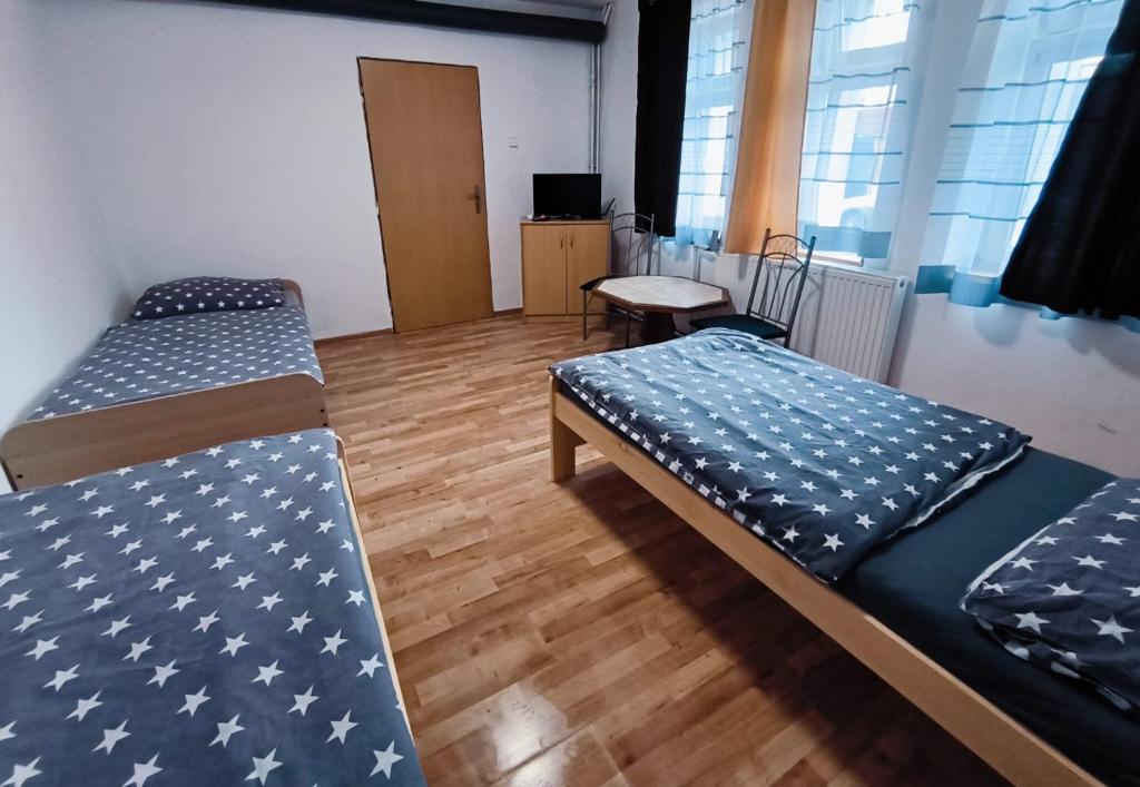 Postel nebo postele na pokoji v ubytování Apartmán Čajkovského