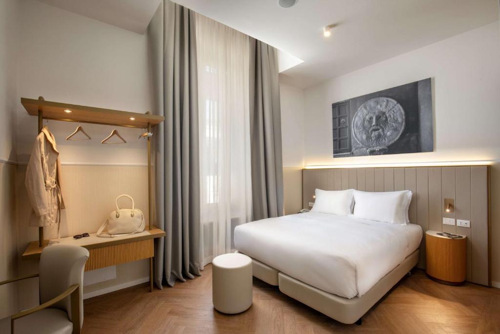 Postel nebo postele na pokoji v ubytování Cosmopolita Hotel Rome, Tapestry Collection by Hilton