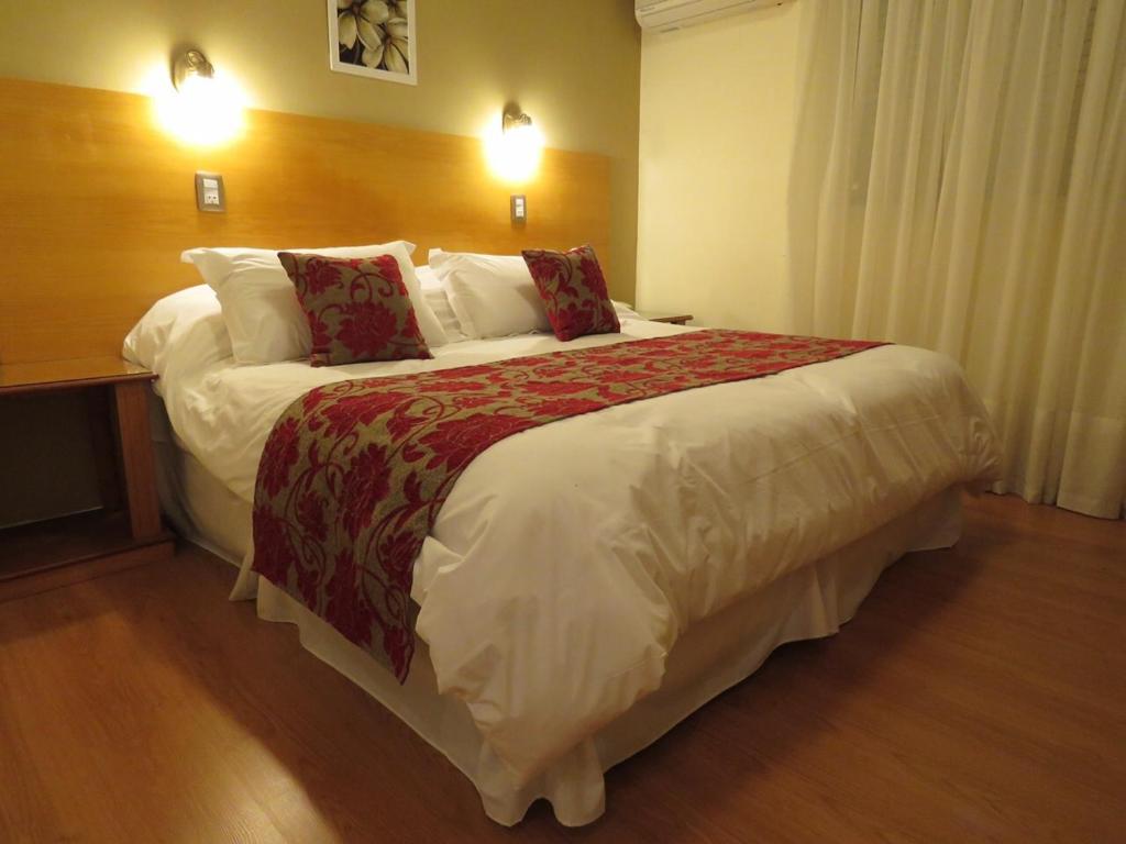 a bedroom with a large bed in a hotel room at Grand Hotel in Reconquista