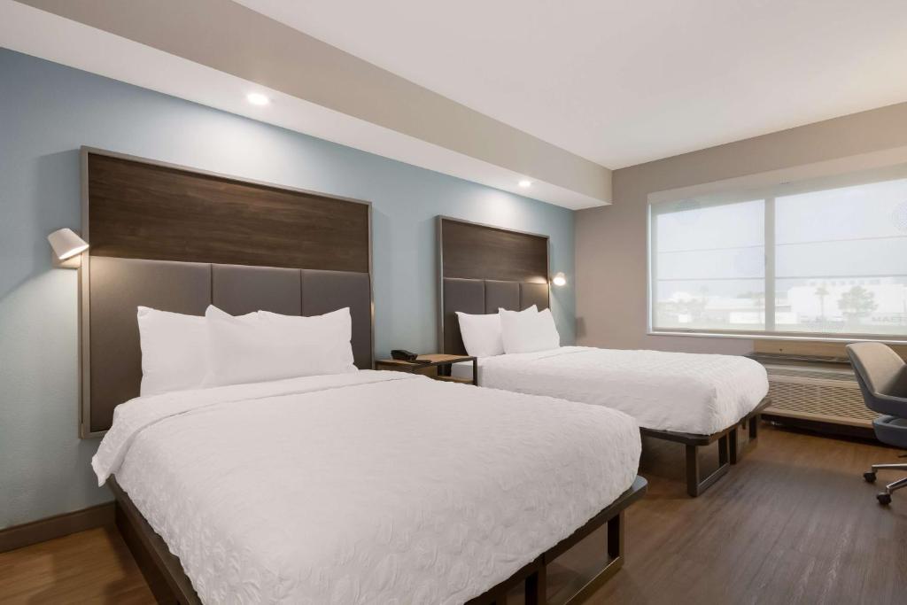 Postel nebo postele na pokoji v ubytování Tru By Hilton Destin