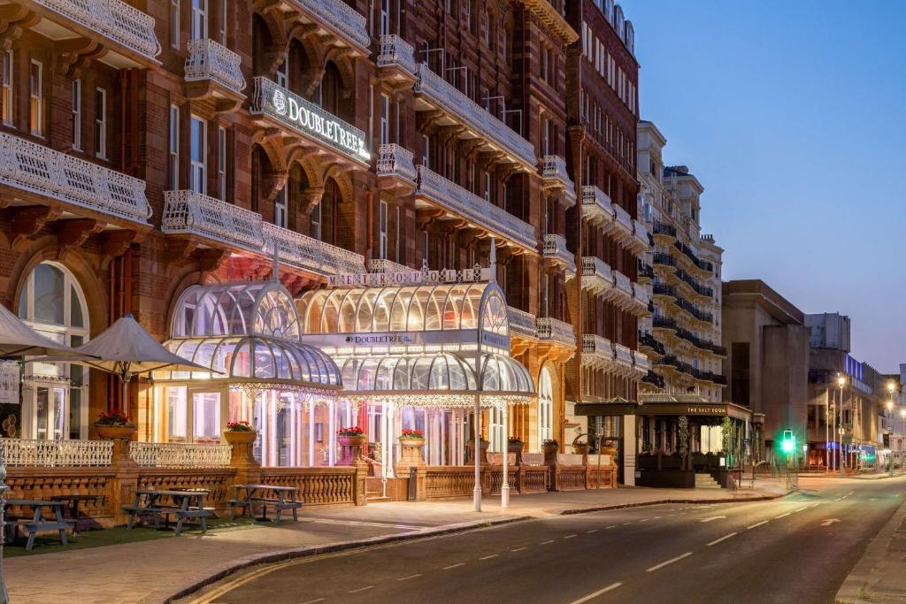 a building with christmas lights on the side of it at DoubleTree By Hilton Brighton Metropole in Brighton & Hove