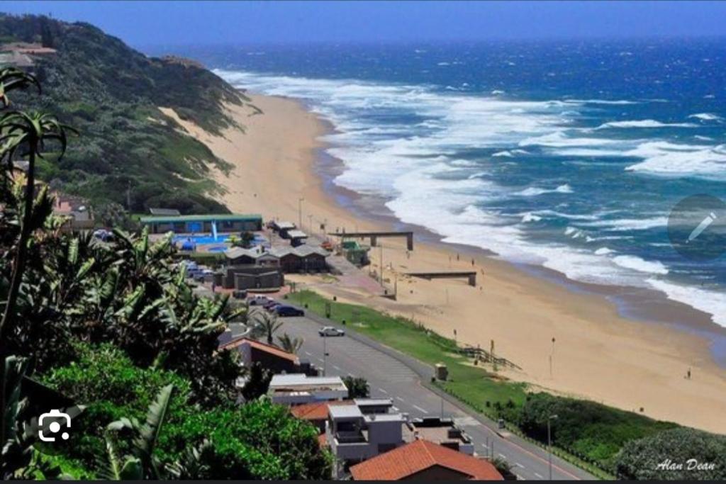 a view of a beach and the ocean at 1211 On Bluff in Durban