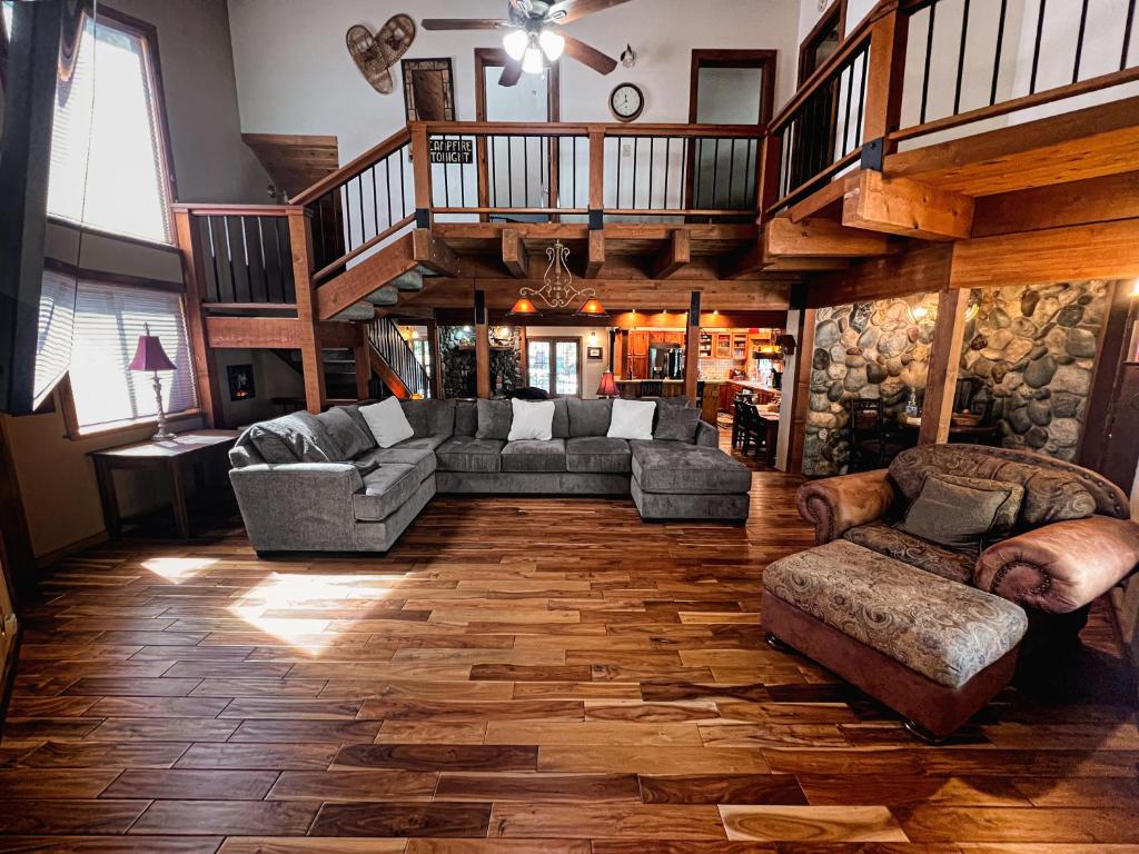 a living room with couches and a wooden floor at Family Haven in Graeagle CA w/King Bed Suite in Graeagle