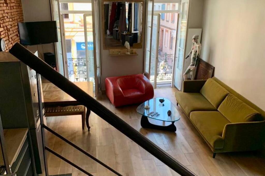 O zonă de relaxare la Bel appartement atypique quartier St Cyprien