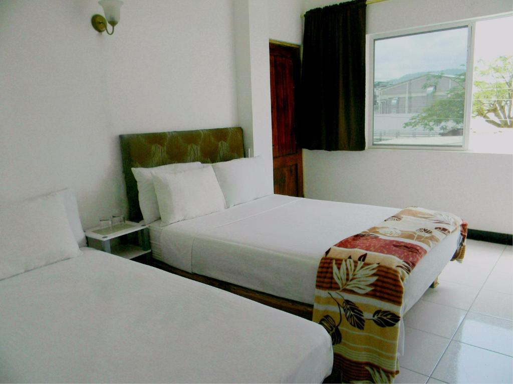 Postel nebo postele na pokoji v ubytování Bahia B&B