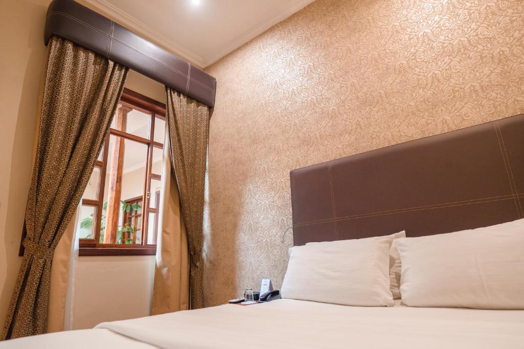 Postel nebo postele na pokoji v ubytování Santa Lucia House - Forum