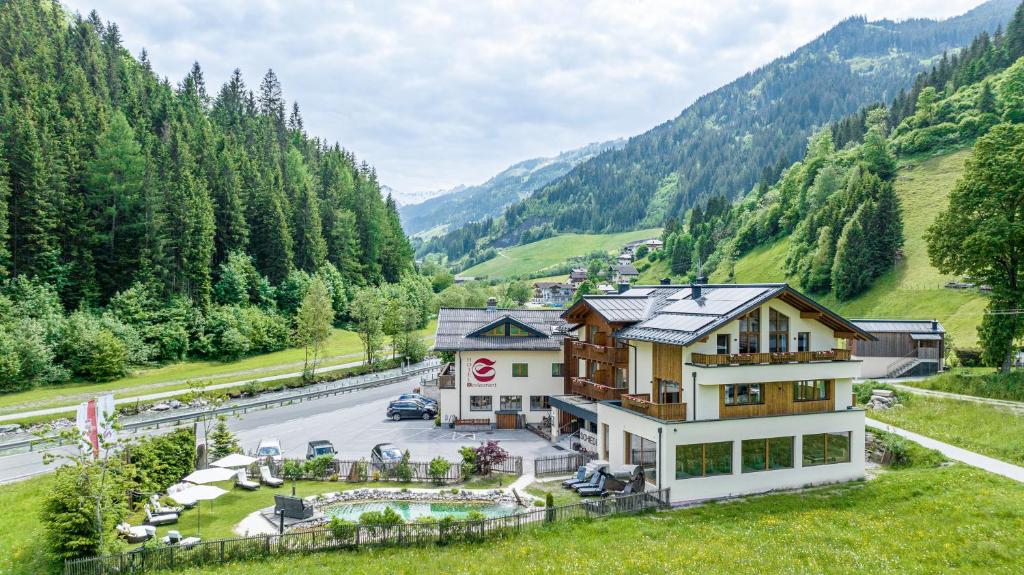 an aerial view of a house in the mountains at Hotel Schiederhof in Grossarl