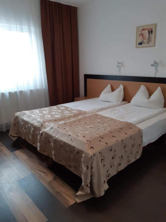 Postel nebo postele na pokoji v ubytování Hotel Mya