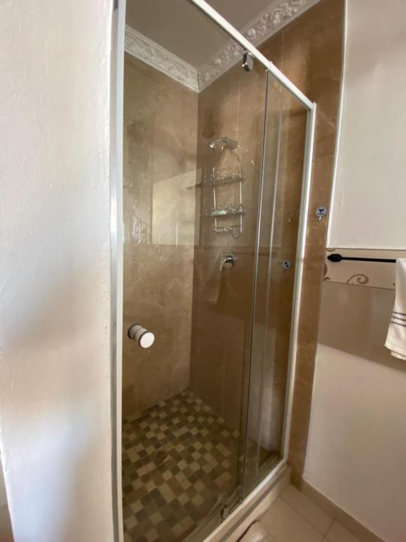 a shower with a glass door in a bathroom at 4 Centenary Road Ixopo in Ixopo