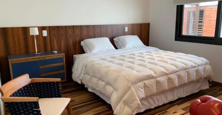 Postel nebo postele na pokoji v ubytování Austin Suites Gramado