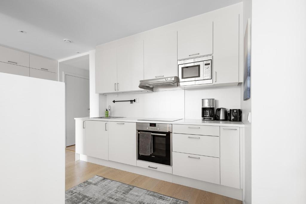 Kuchyň nebo kuchyňský kout v ubytování Spacious modern 2BR apartment at Central OSLO BARCODE