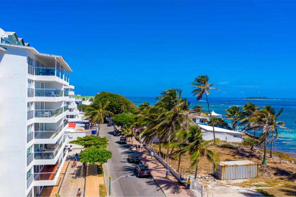 a street in front of a building and the ocean at Sea View 603B in San Andrés