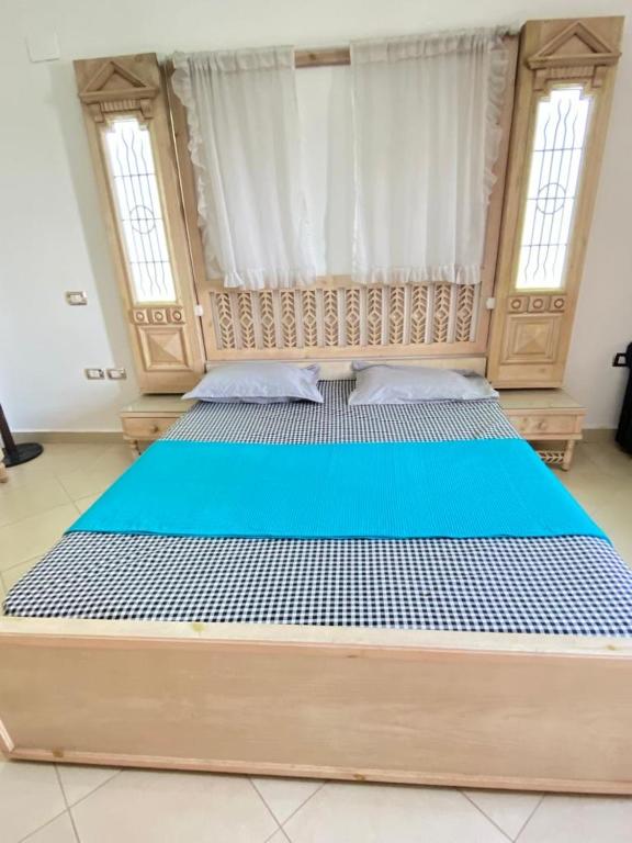 Postel nebo postele na pokoji v ubytování فيلا للإيجار مارينا 7 الساحل الشمالي