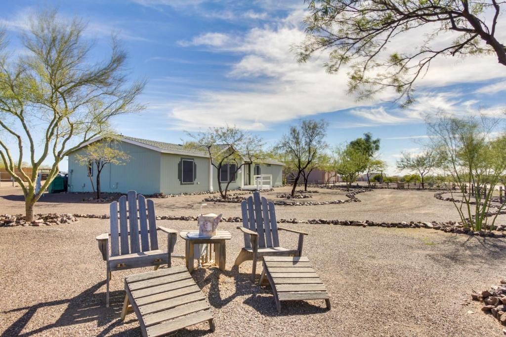 two blue chairs and a table and a house at Phoenix Family Home Near Cave Creek and Hiking! in Phoenix