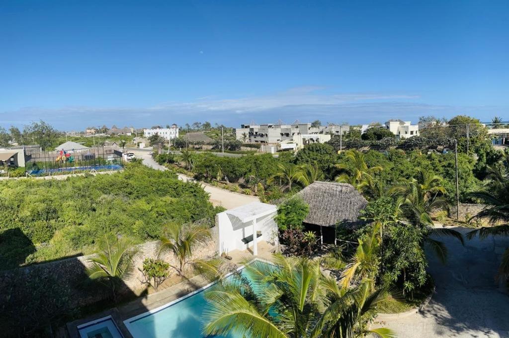 an aerial view of a resort with a swimming pool at Manasha Apartment 1 in Watamu