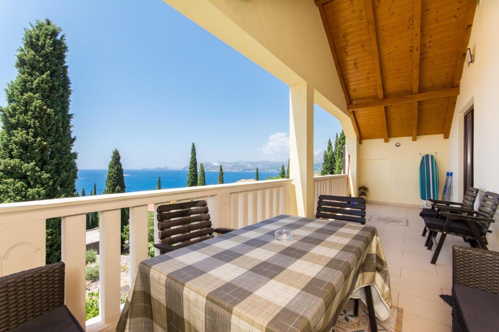 a patio with a table and chairs on a balcony at Apartments Šiljug in Cavtat