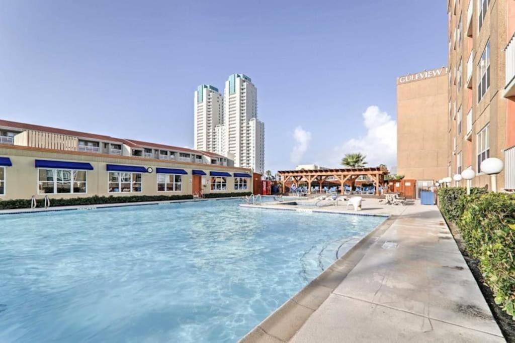 a swimming pool in the middle of a building at 1 Bedroom Studio Near Beach w Pool & Amenities in South Padre Island