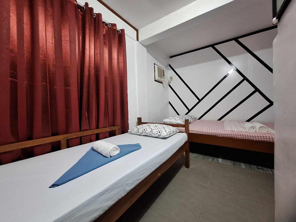 Postel nebo postele na pokoji v ubytování Blessed Inn Annex