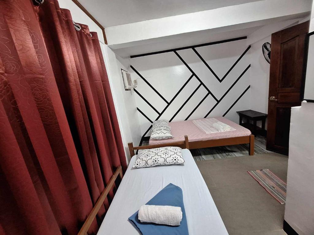 Postel nebo postele na pokoji v ubytování Blessed Inn Annex