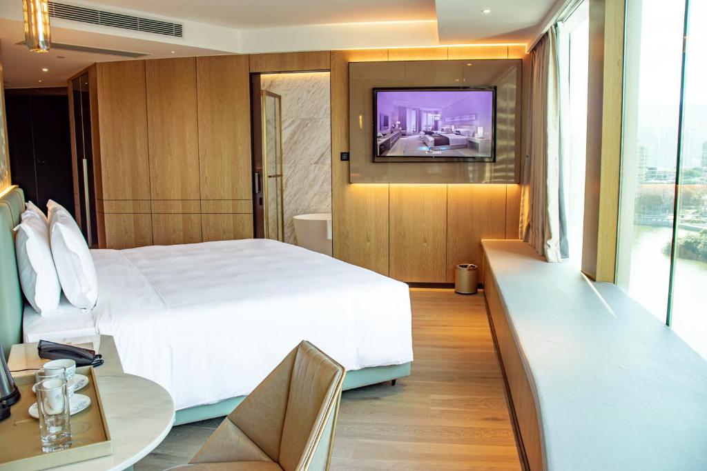 TV a/nebo společenská místnost v ubytování YOHO Treasure Island Hotel
