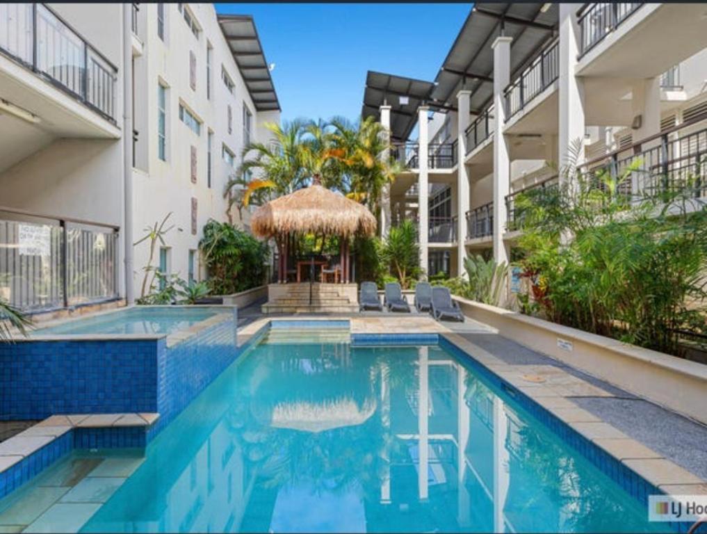 a swimming pool in front of a building at 347 Paradiso Kingscliff Beach 3 Bedroom Private Rooftop in Kingscliff