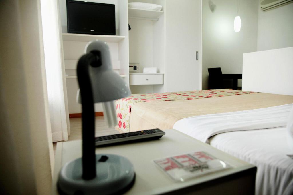 Postel nebo postele na pokoji v ubytování Iguatemi Business & Flat by Avectur