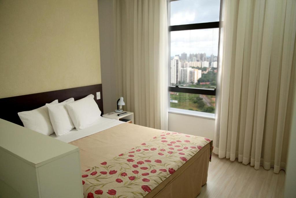 Postel nebo postele na pokoji v ubytování Iguatemi Business & Flat by Avectur