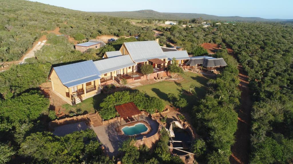 an aerial view of a house in the middle of a forest at Valley Bushveld Country Lodge in Addo
