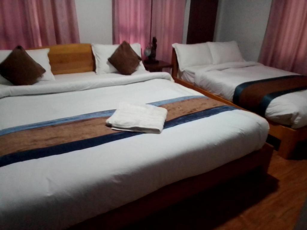 Postel nebo postele na pokoji v ubytování Heritage Home Dhulikhel
