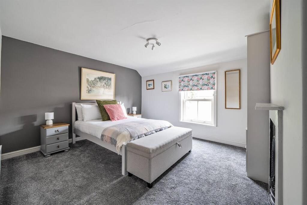 a bedroom with a bed and a window at Ivy Cottage Nestled Near The White Horse in York