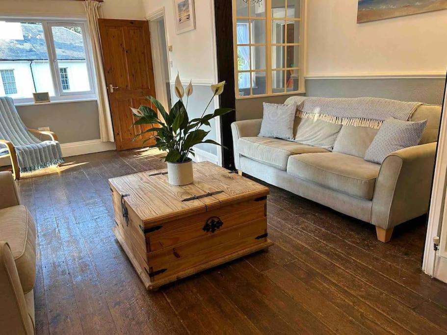 a living room with a couch and a coffee table at The ideal retreat for some vitamin sea! in Sandgate