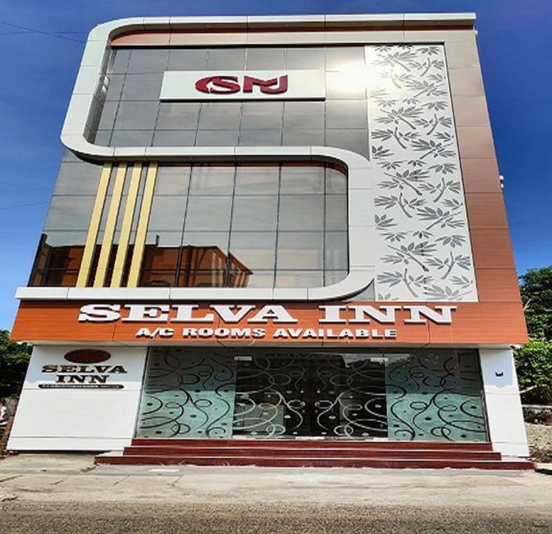 a building with a sierra inn sign on it at Selva Inn in Pondicherry