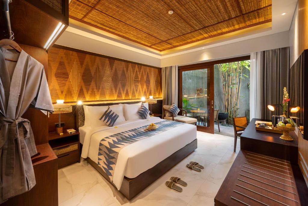 Postel nebo postele na pokoji v ubytování The Hava Ubud A Pramana Experience