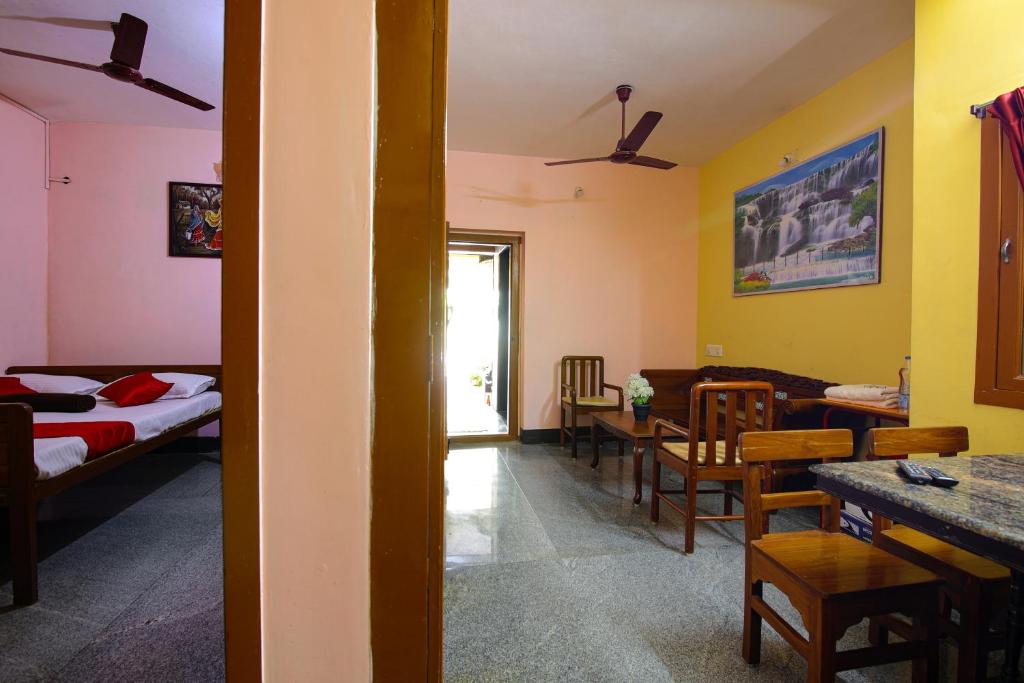 Postel nebo postele na pokoji v ubytování Manora Residency