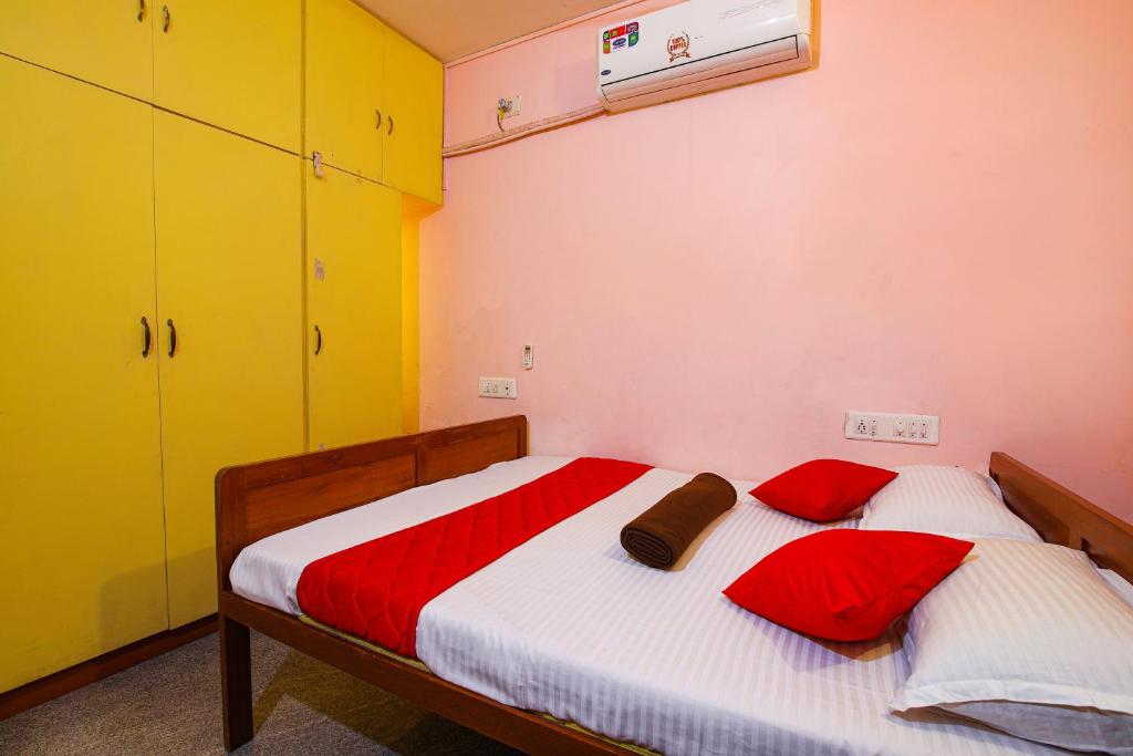 Postel nebo postele na pokoji v ubytování Manora Residency