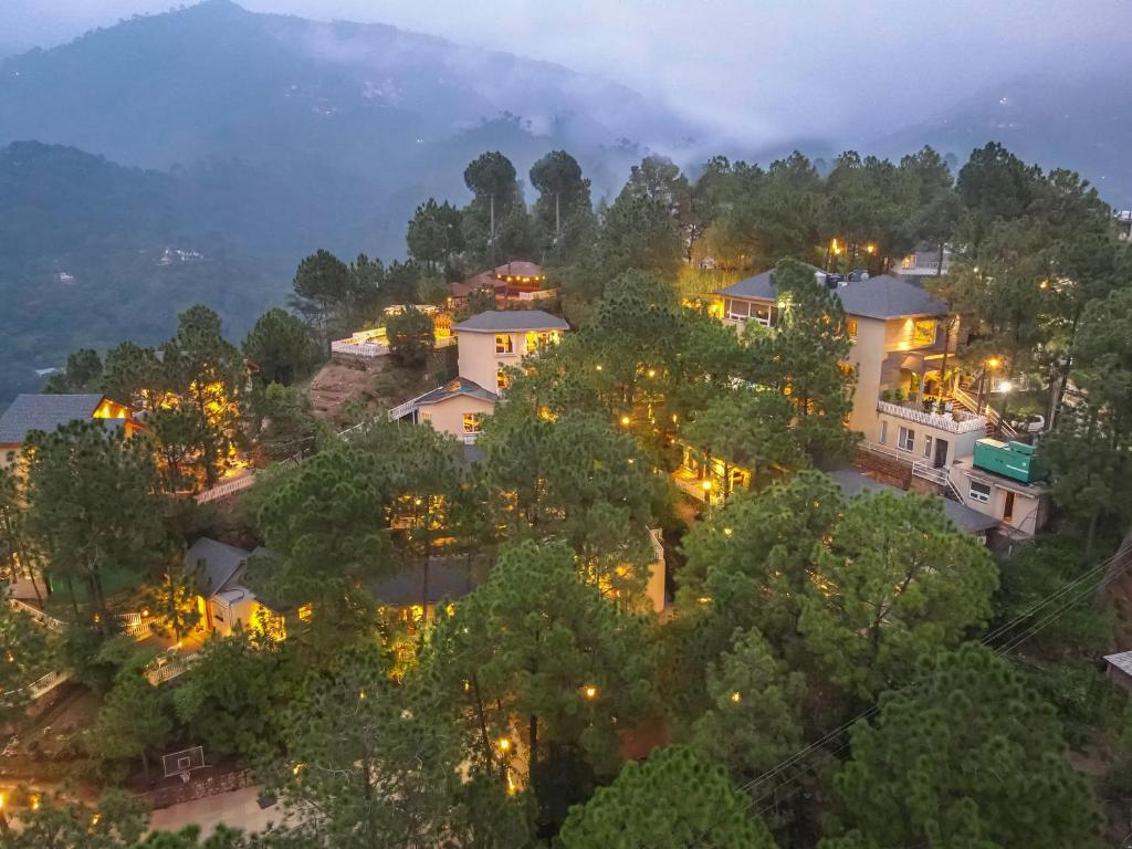 an aerial view of a home at night at Jungle Lodge Resort in Kasauli