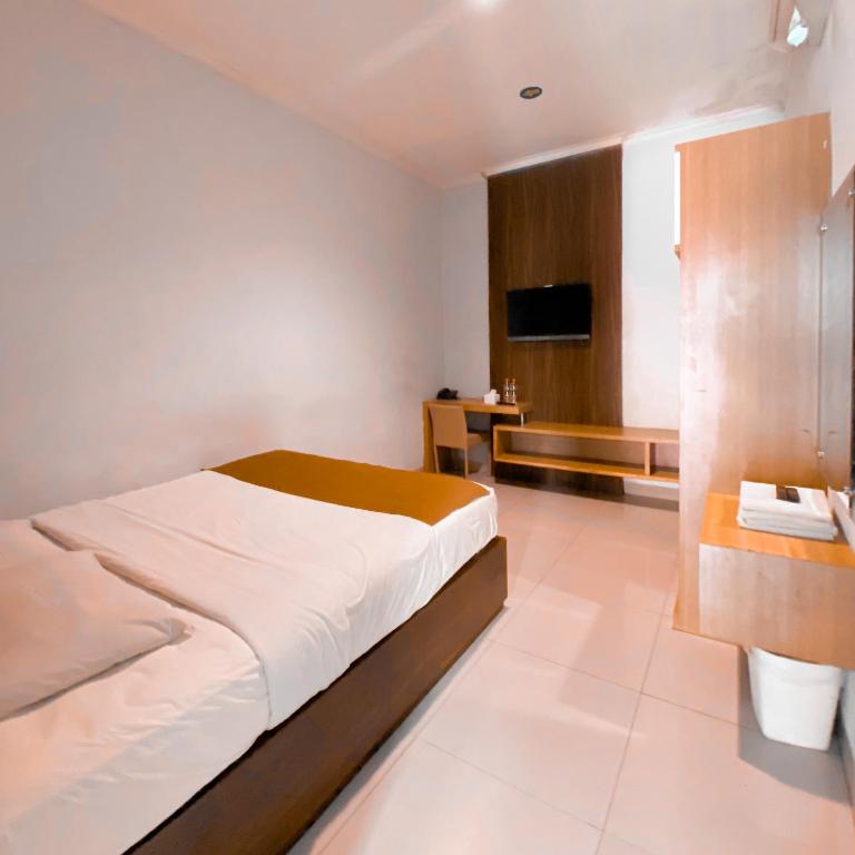 Postel nebo postele na pokoji v ubytování DINASTY STYLE HOTEL SOLO