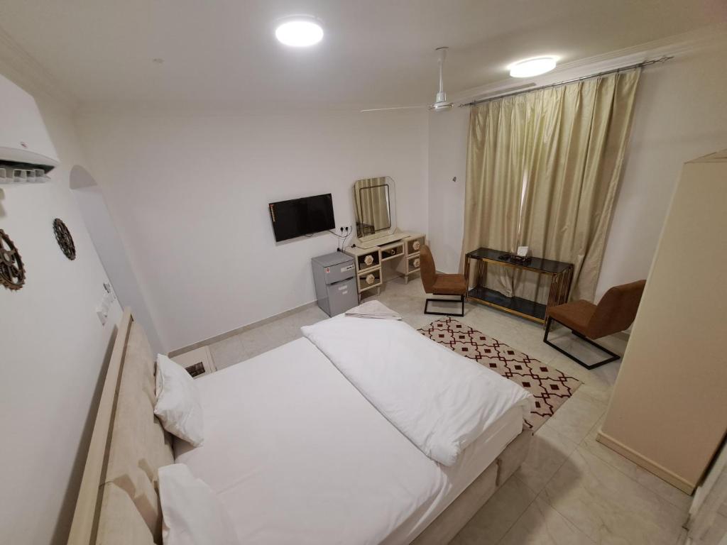Postel nebo postele na pokoji v ubytování نسائم صلاله للشقق الفاخرة Nassayem Salalah Downtown